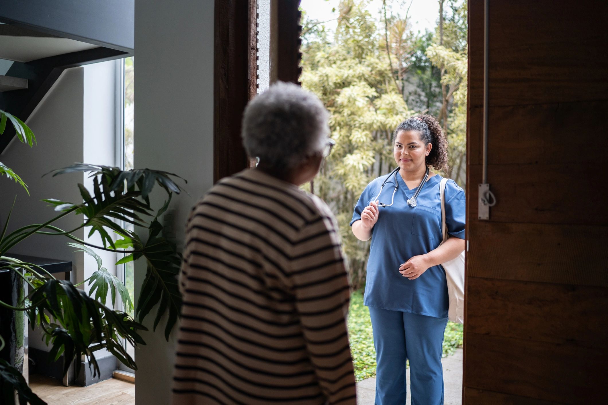 Healthcare worker arriving for a client home visit