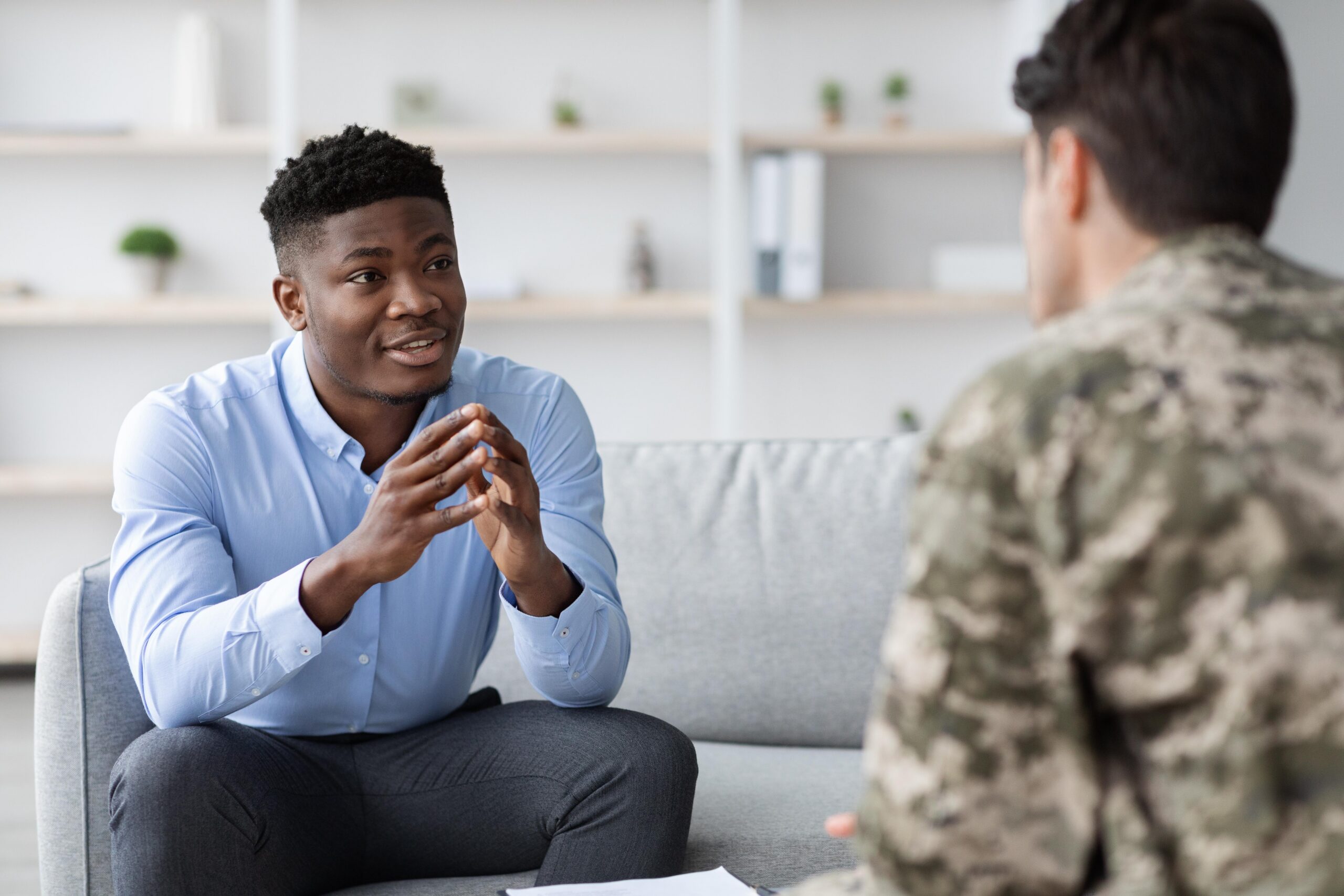 Therapist supporting a child during a therapy session